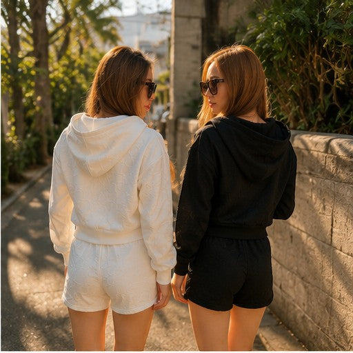 THREE PEACE white Y2K lounge set with cropped zip-up hoodie and shorts, featuring jacquard monogram pattern.
